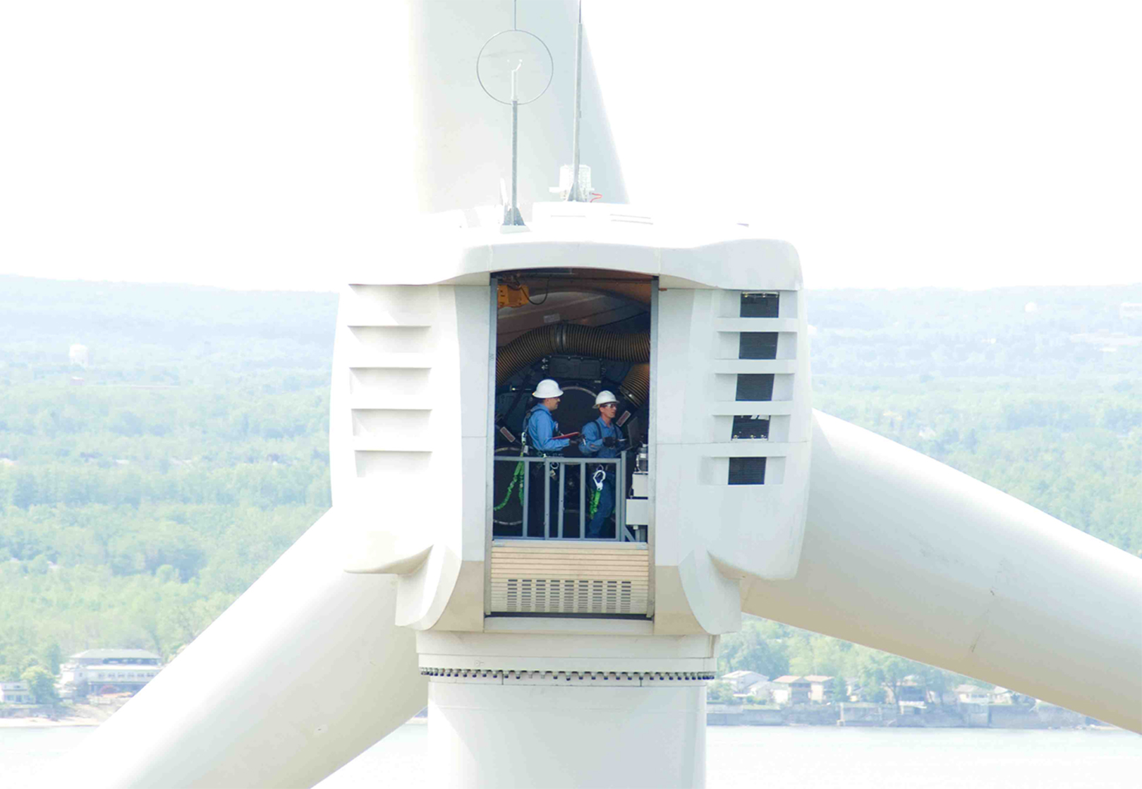 Technicians inside the nacelle of a Clipper Liberty wind turbine