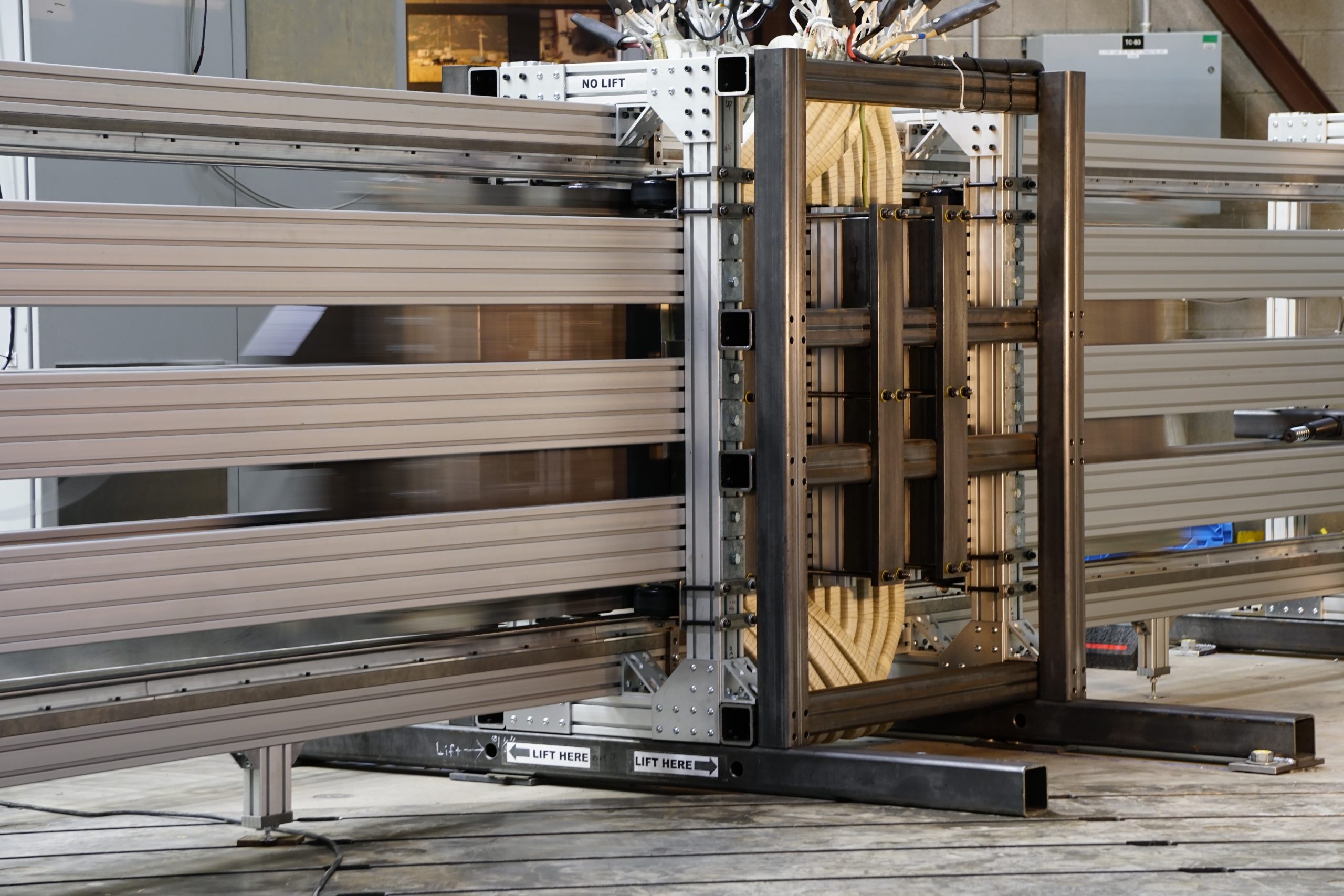 The 60 kW prototype LUMA power take-off on its oscillation test rig, translator mid-stroke